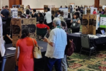 Photo of people at poster session.